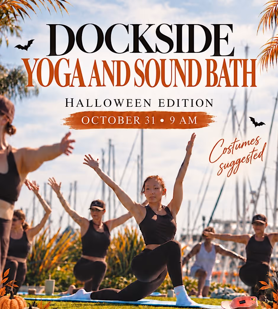 Promotional graphic for the event: Dockside Yoga and Sound Bath, Halloween Edition, October 31, 9 AM, costumes suggested, over a photo of a yoga class holding a low lunge with arms raised beside a marina full of sailboat masts