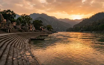 Sunset view of ghats and the Ganges River in Rishikesh, India, with Himalayan foothills behind
